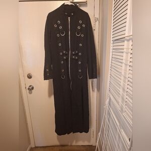 Full-length TRIPP black denim coat with Silver Colored Grommets.